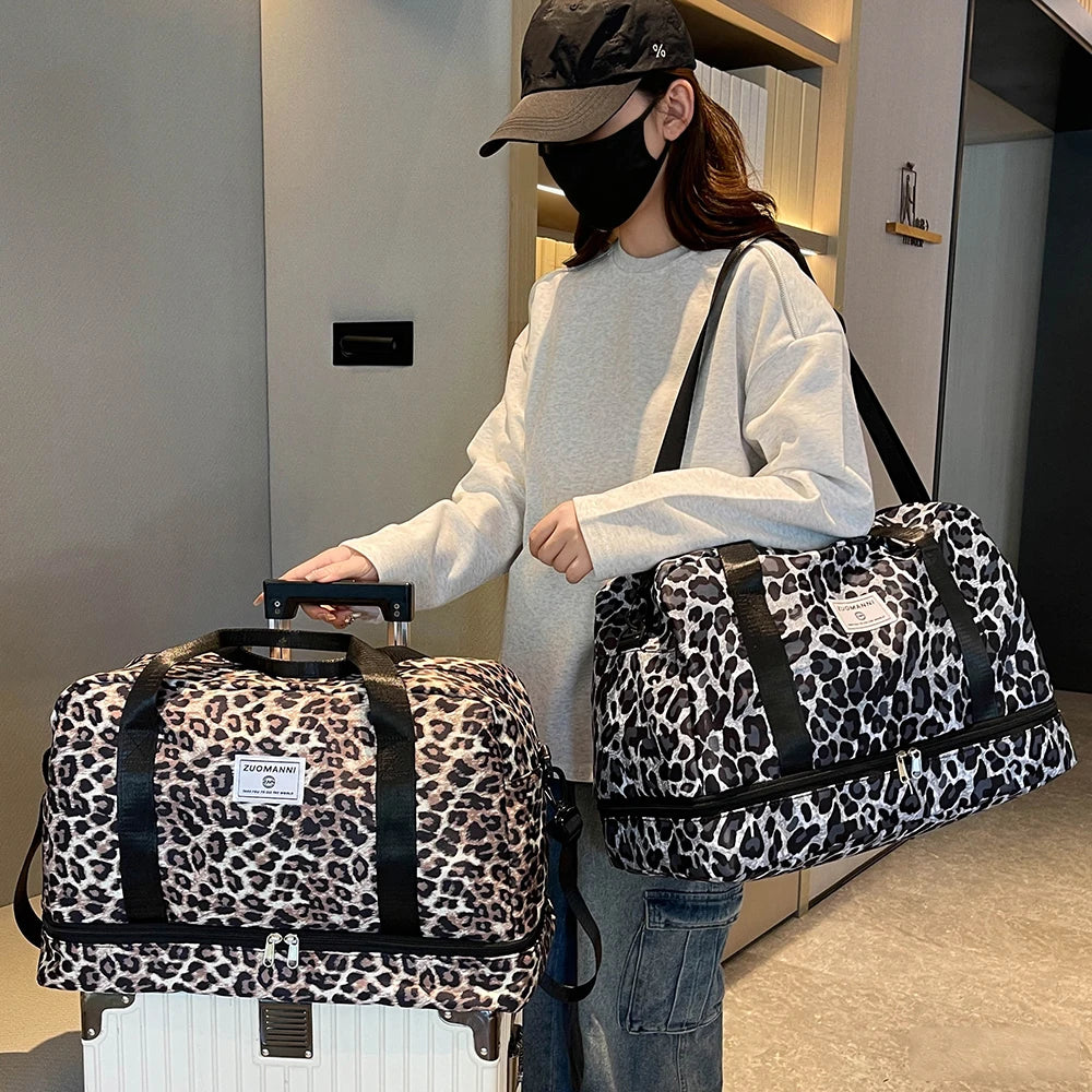 A woman holds a leopard print travel duffel bag with a shoe compartment in a modern indoor setting.