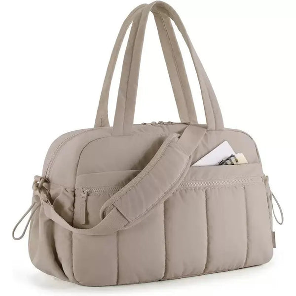 A beige versatile large capacity travel and fitness bag with padded compartments.