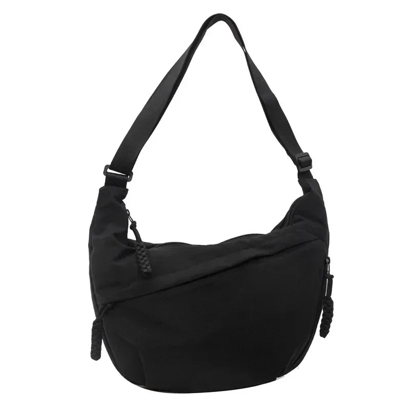 Black soft nylon crossbody shoulder bag with an adjustable strap