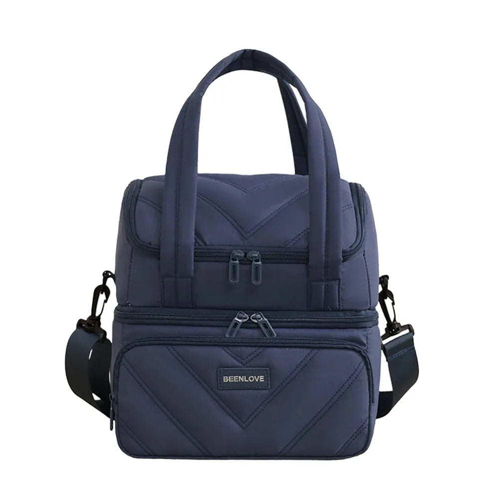 Bolsa térmica reutilizable y a prueba de fugas azul marino con patrón acolchado.