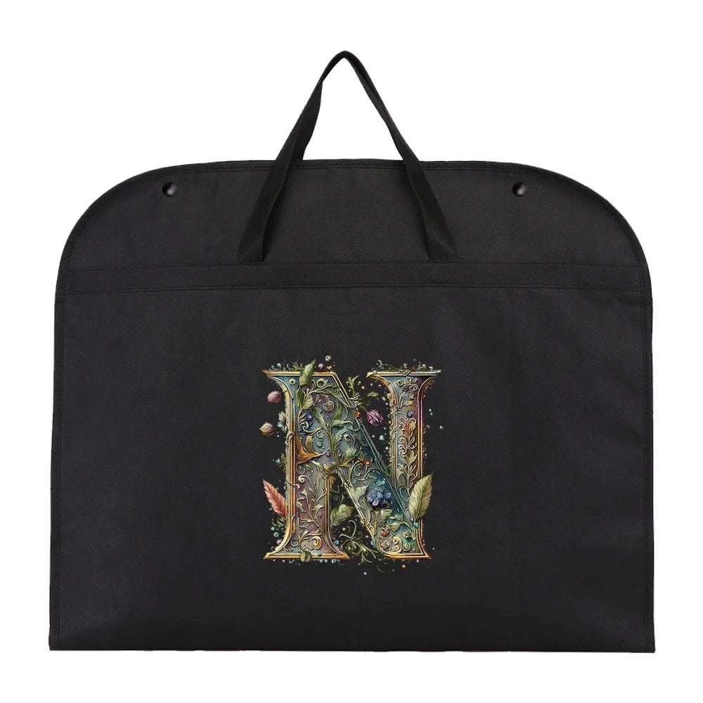 Black fabric dust cover and storage bag with a large ornate letter N embroidered on it.