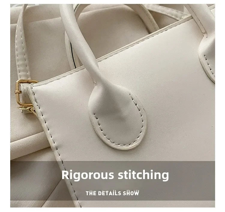 Gros plan d'un sac à main en cuir PU minimaliste crème, montrant les détails de la couture rigoureuse.