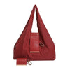 A maroon cloth storage pouch with a flap closure and leather keychain attached.