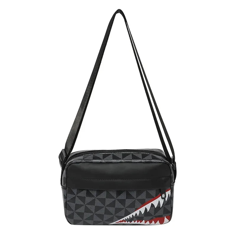 Black stylish square crossbody purse with a geometric pattern and a red and white shark tooth design.