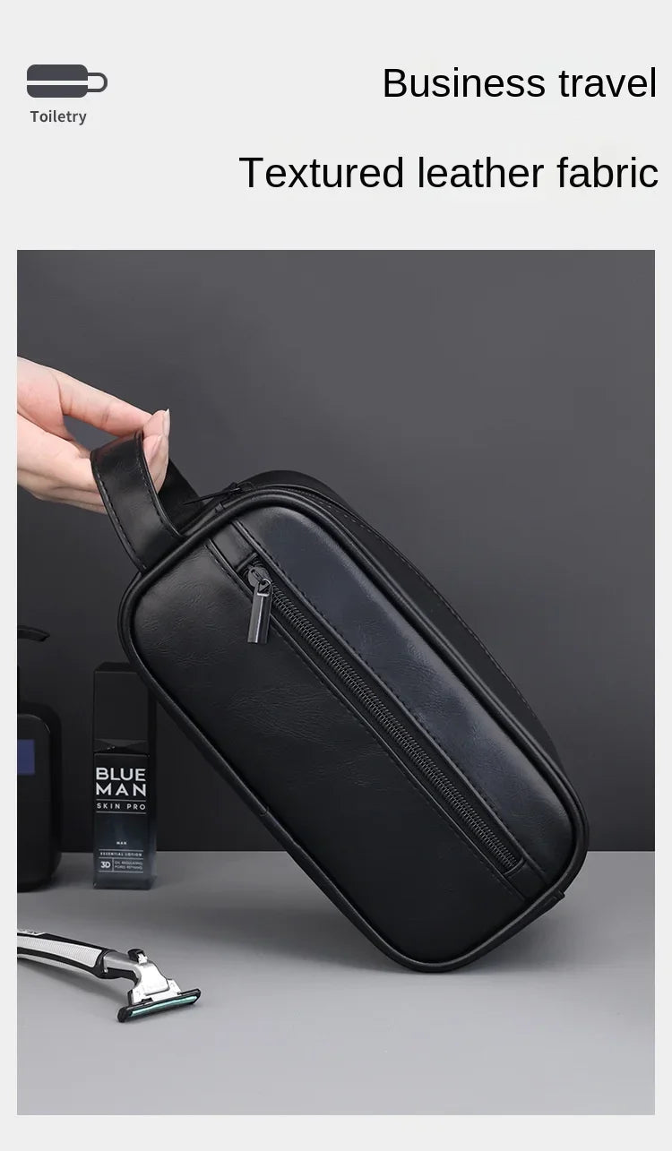 A black textured leather cosmetic bag is shown next to a razor and a blue man skin product.