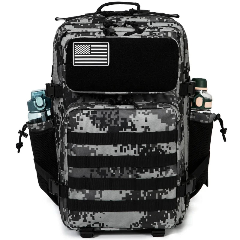 A black and gray tactical backpack featuring a flag patch, MOLLE webbing, and a laptop compartment.