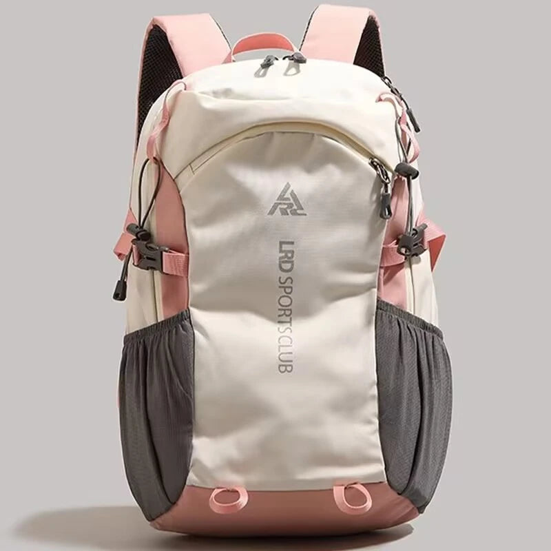 A beige and pink hiking backpack with black accents shown from the front.