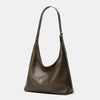 A dark brown soft PU leather retro tote bag with a long strap and zipper closure.