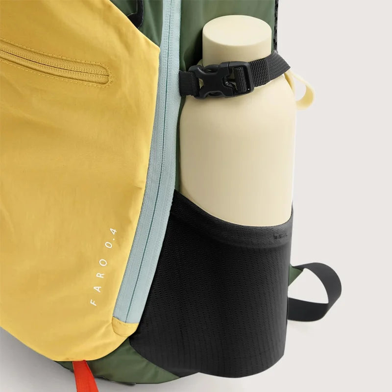 A yellow laptop backpack is shown next to a white bottle and a black fabric item.
