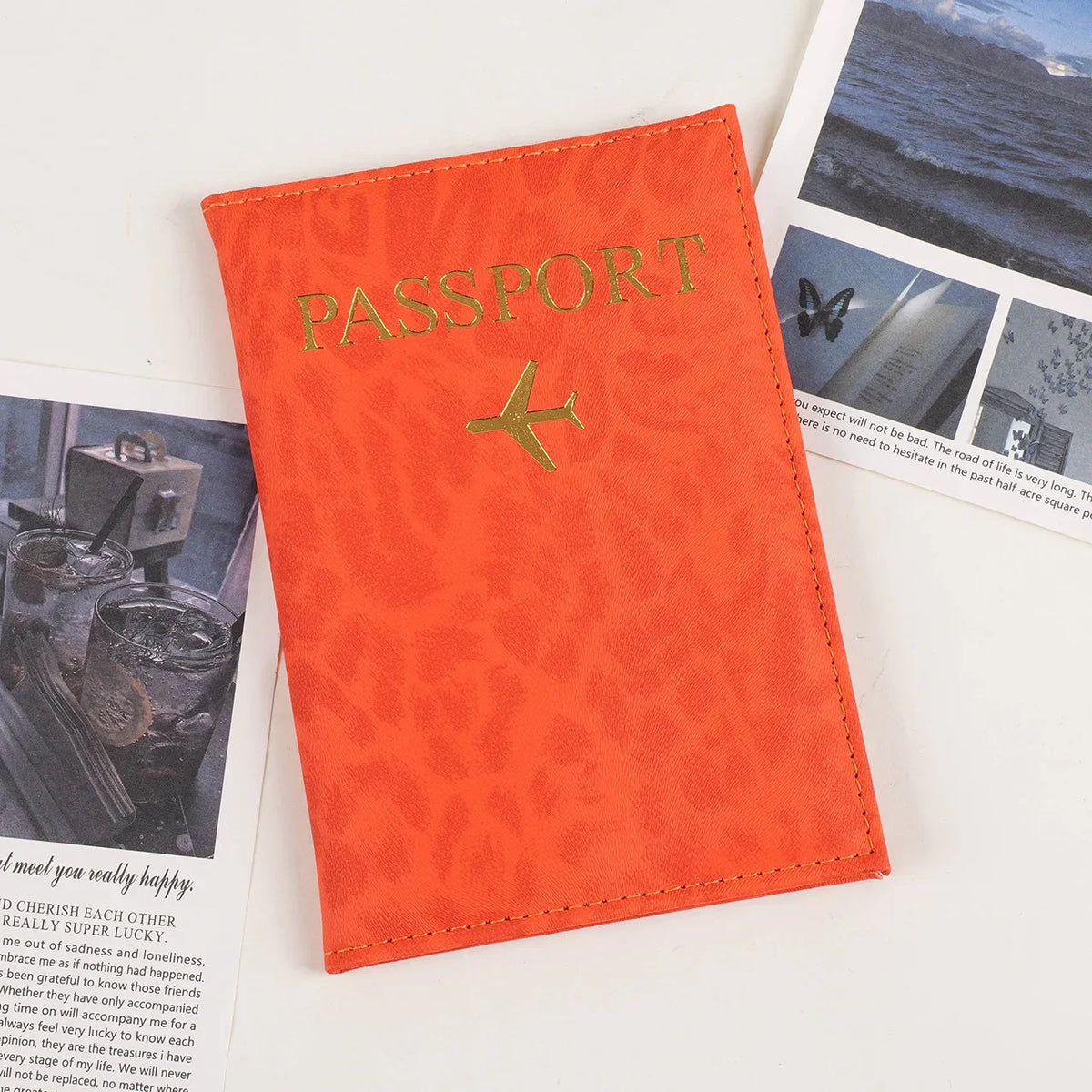 Orange leopard print PU leather passport holder with gold foil lettering and a passport photo inside.