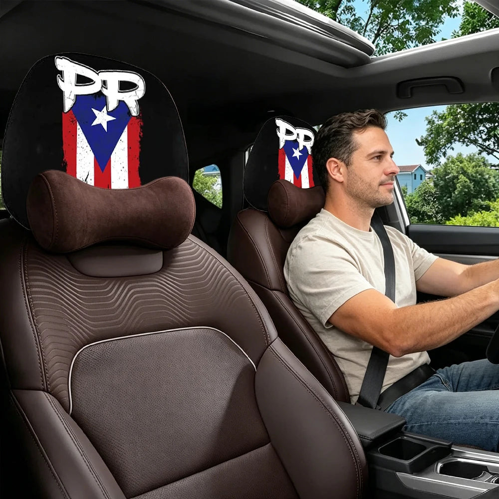 A man sits in a car with leopard print headrest covers visible on the seats.