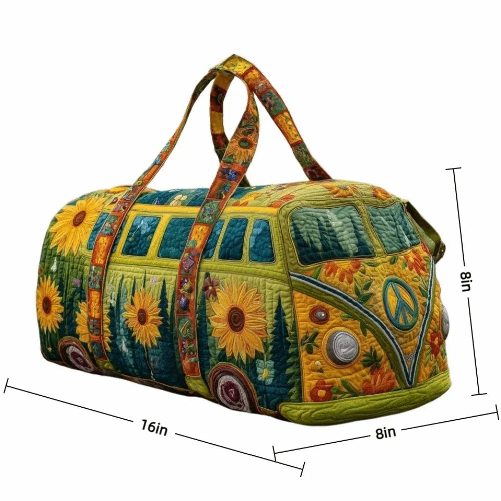 A quilted travel duffle bag featuring a vibrant floral pattern with yellow, green, and orange tones.