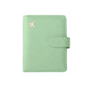 A light mint green RFID-blocking travel passport organizer with a leather cover and card slots.