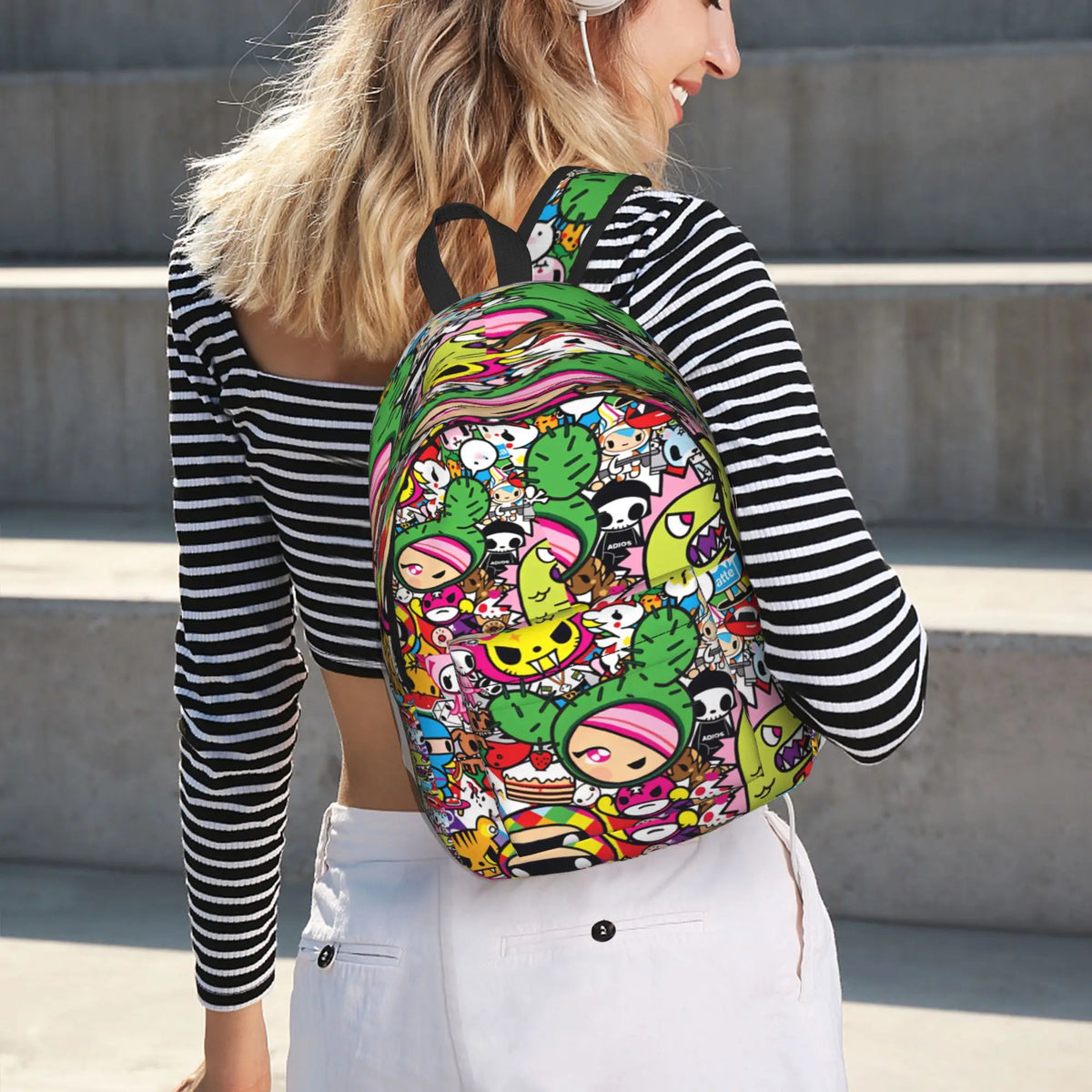 A woman is wearing a colorful, patterned sport backpack while standing outdoors.