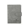 A grey leather passport organizer with a protective sleeve and card slots.