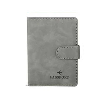 A grey leather passport organizer with a protective sleeve and card slots.