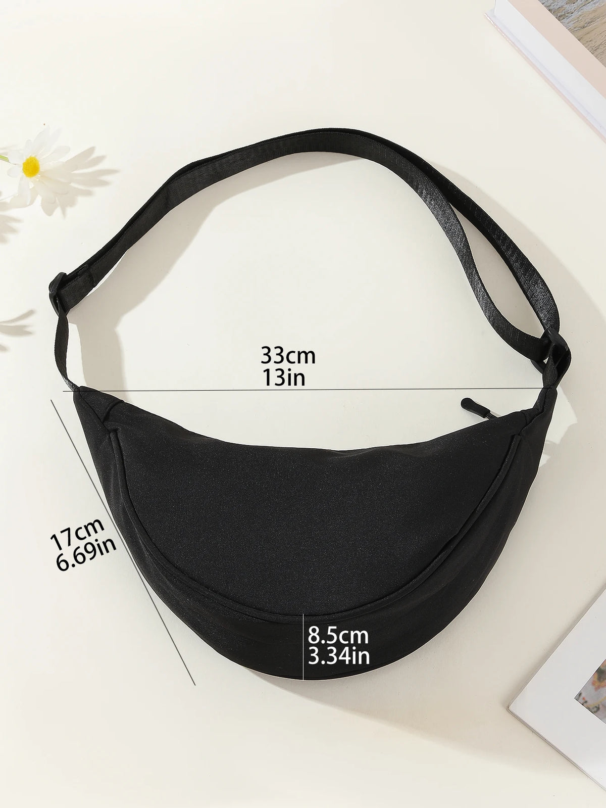 Black women's preppy sling crossbody bag shown with size measurements on a light background.