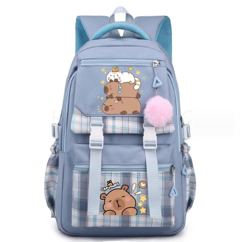 A light blue canvas backpack featuring a cute capybara print and plaid accents.