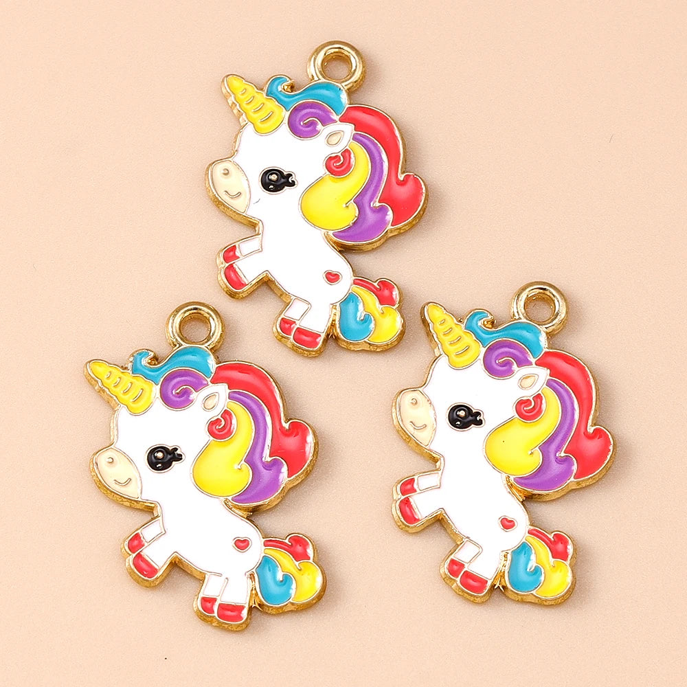 Two gold-plated unicorn horse charm pendants featuring rainbow colored hair and white bodies.
