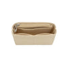 Un insert organisateur de sac beige conçu pour s'adapter aux mini-sacs à main.