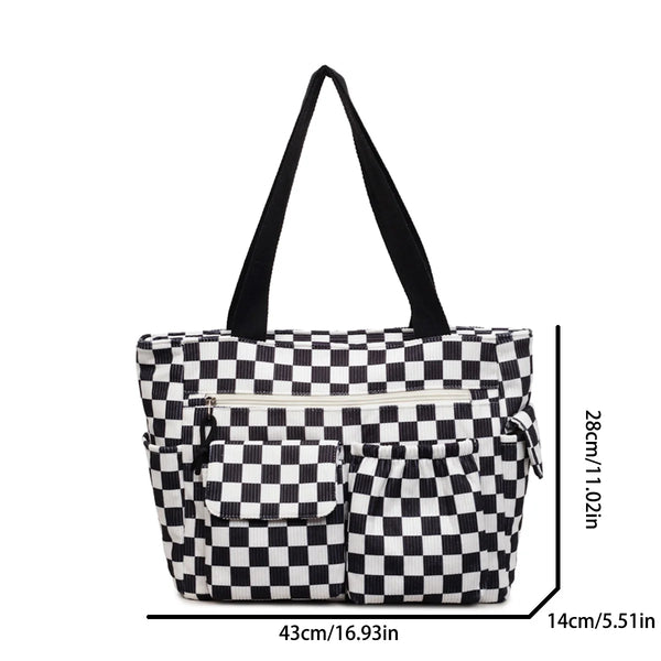 A black and white checkered stripe pattern corduroy tote bag with black handles.