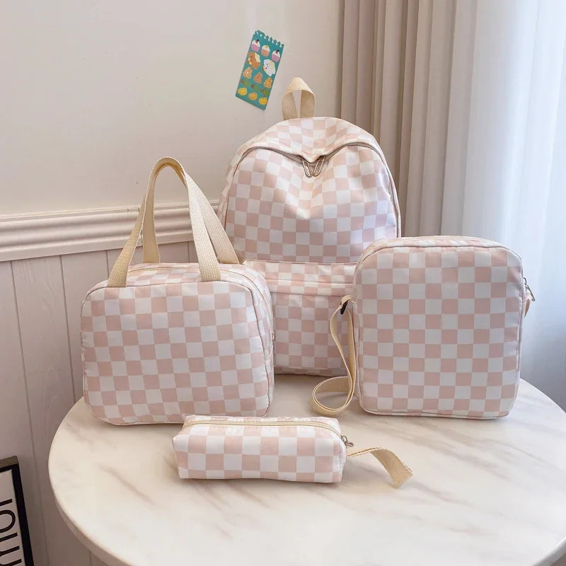 A light pink and white checkered multi-pocket backpack in various sizes is displayed on a white marble surface.
