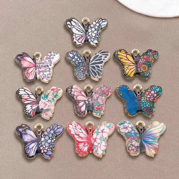 A set of colorful butterfly enamel charms featuring various vibrant colors and patterns.
