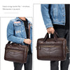 A brown full-grain leather executive laptop briefcase being held by a person.