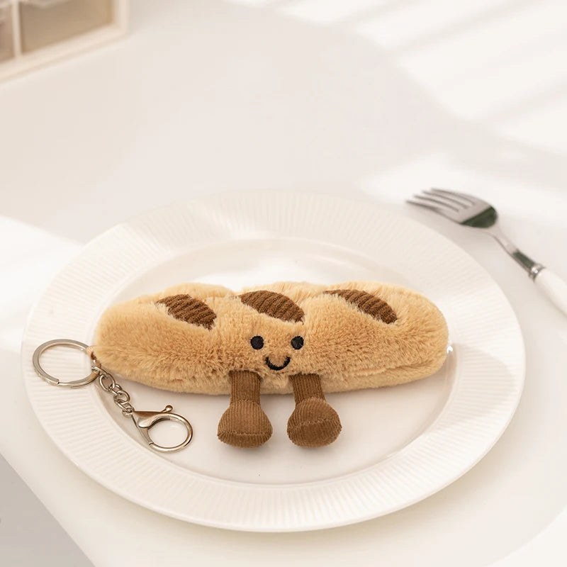 A fluffy brown cartoon character plush toy shaped like a loaf of bread resting on a white plate.