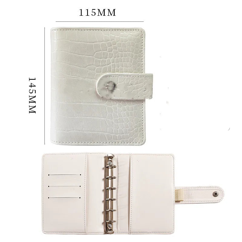 A white leather ring binder notebook with a crocodile texture shown in two views.