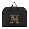 Black fabric dust cover and storage bag with an ornate gold initial M embroidered on it.