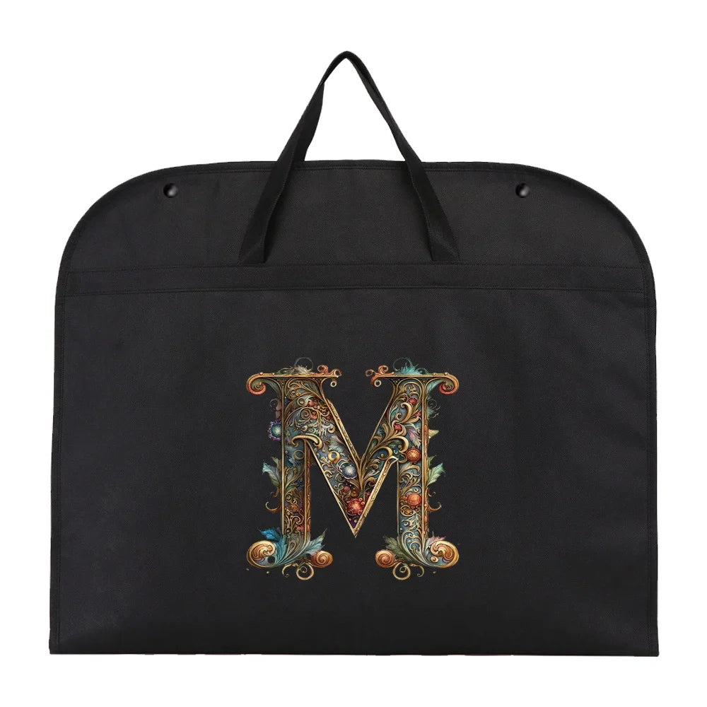 Black fabric dust cover and storage bag with an ornate gold initial M embroidered on it.