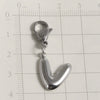 Silver stainless steel alphabet letter charm with a lobster clasp placed on a ruler.