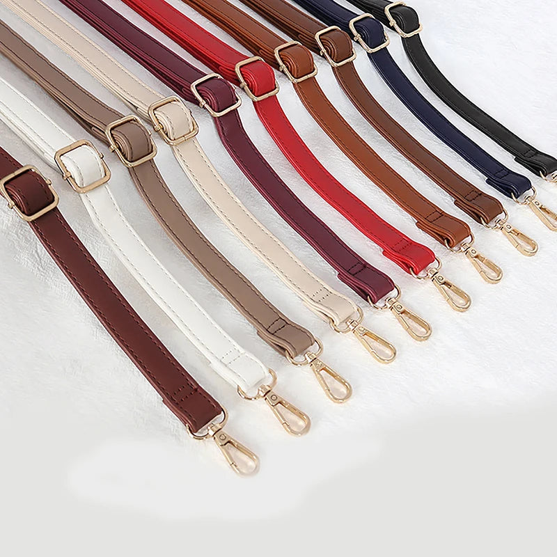 A collection of adjustable PU leather crossbody bag straps in various colors including brown, red, black, and beige.