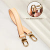 A light tan genuine leather replacement shoulder strap with a non-destructive hook is shown against a white background.