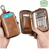 A brown PU leather key organizer wallet is shown open, displaying multiple keys and a clear card slot.