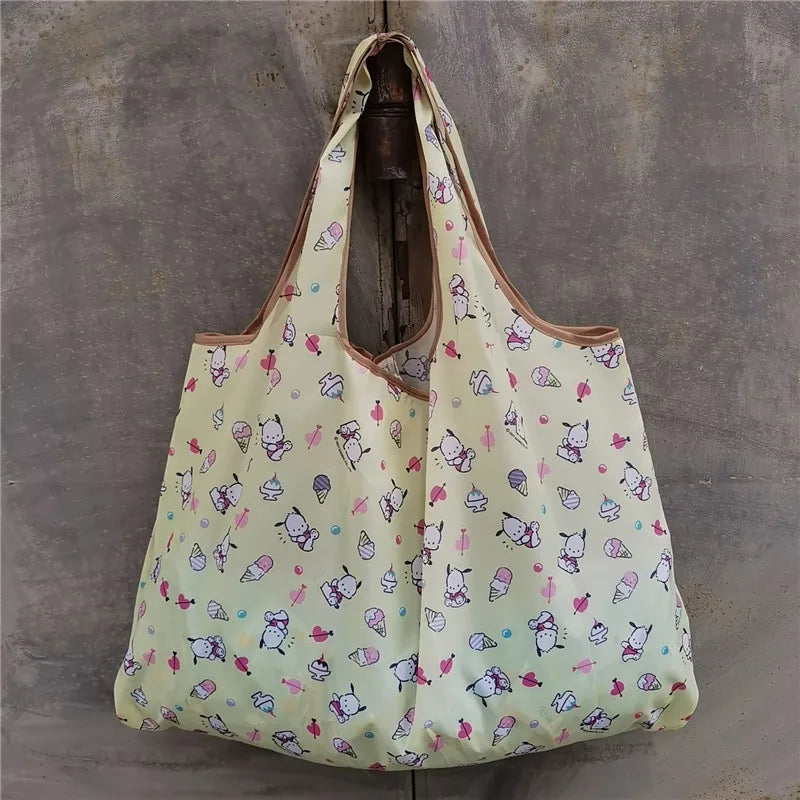 A light yellow reusable shopping bag patterned with small pastel-colored illustrations of animals and food items.