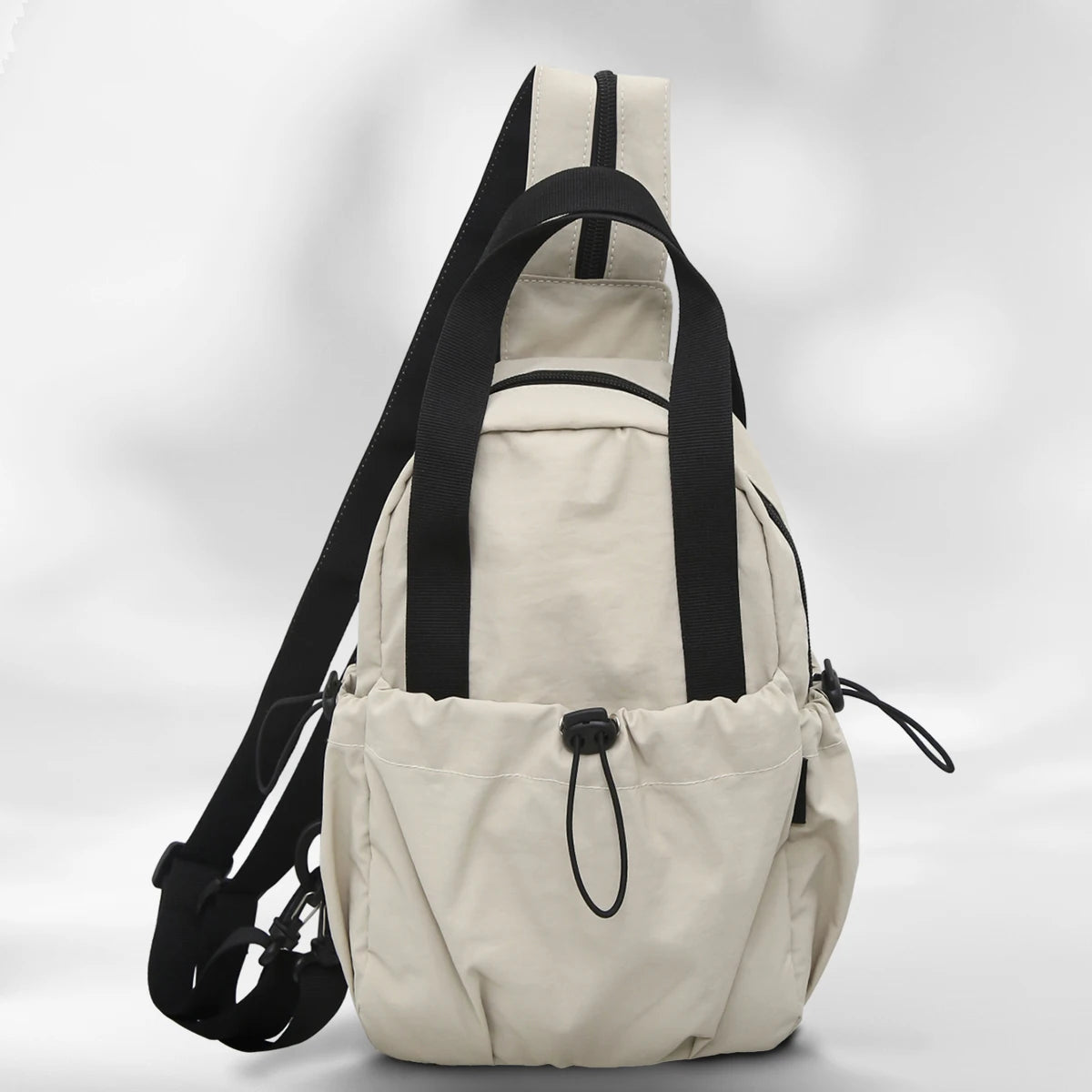 A beige casual backpack with black straps and a laptop compartment shown from the back.