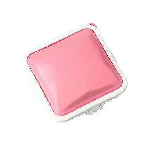 A pink silicone reusable sandwich and lunch container with a clear lid.