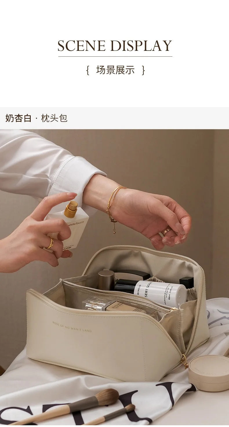 A beige foldable cosmetic storage bag is shown open, revealing various makeup products and brushes.