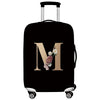 Black premium stretch luggage protective cover with a large gold letter M design