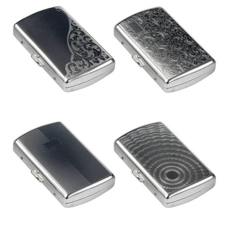Two compact metal cigarette cases, one silver and one dark gray with engraved patterns.