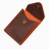 A brown genuine cowhide leather wallet folded and displayed on a white background.