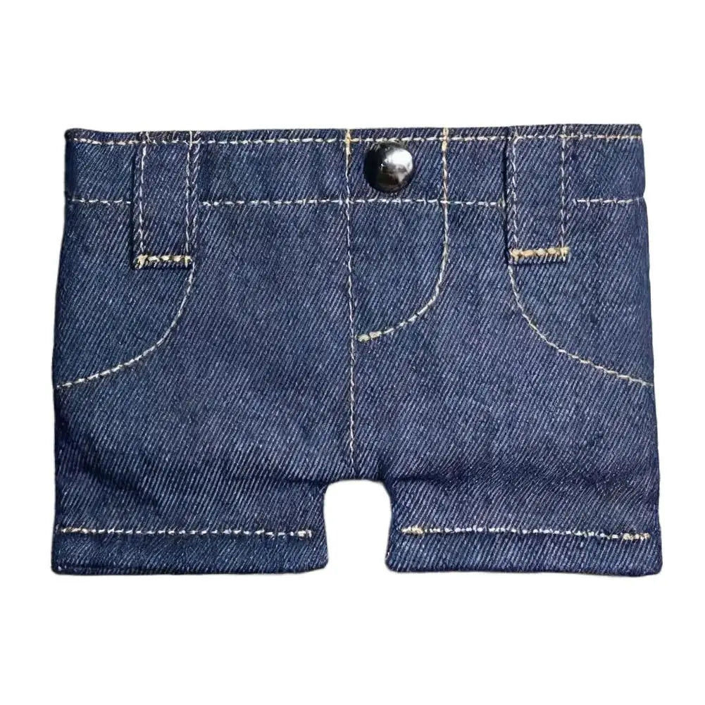 A dark indigo denim mini wallet and card holder with visible stitching and a metal snap closure.