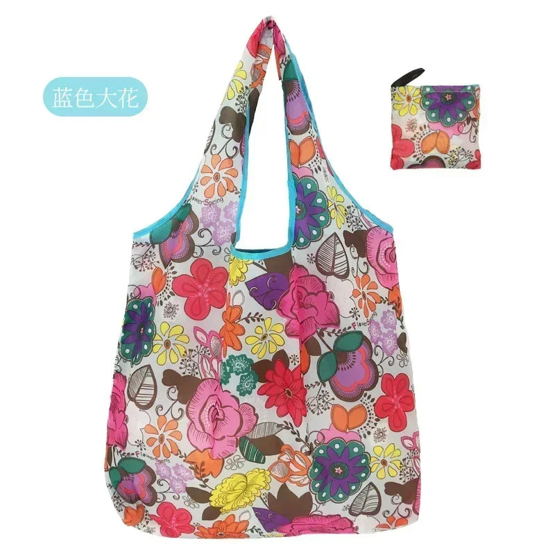 A colorful floral print tote bag featuring pink, purple, and orange flowers.