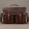A brown vintage Crazy Horse leather briefcase with a top handle and two internal compartments.