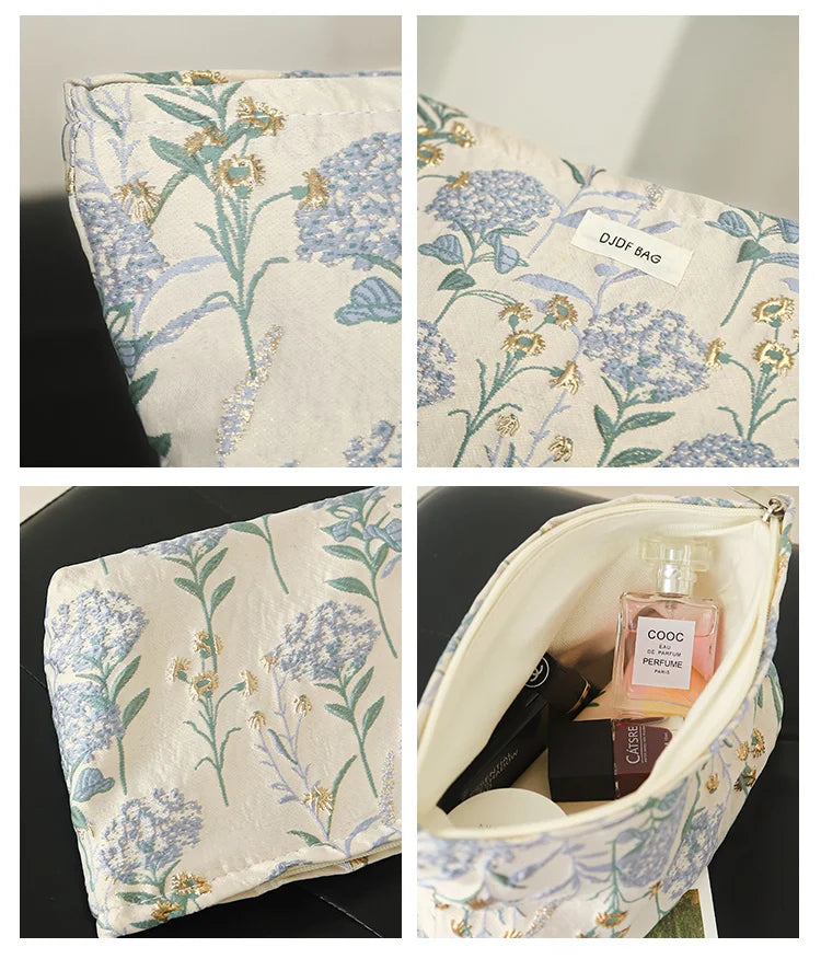 Floral canvas makeup bag featuring blue and yellow floral embroidery on a cream fabric.