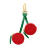 Rotes Leder-Obst-Charm Münztasche Schlüsselanhänger mit goldfarbener Schnalle und grünem Stoffloop.