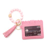 Pink silicone bead bracelet attached to a pink leather card holder with a credit card visible.