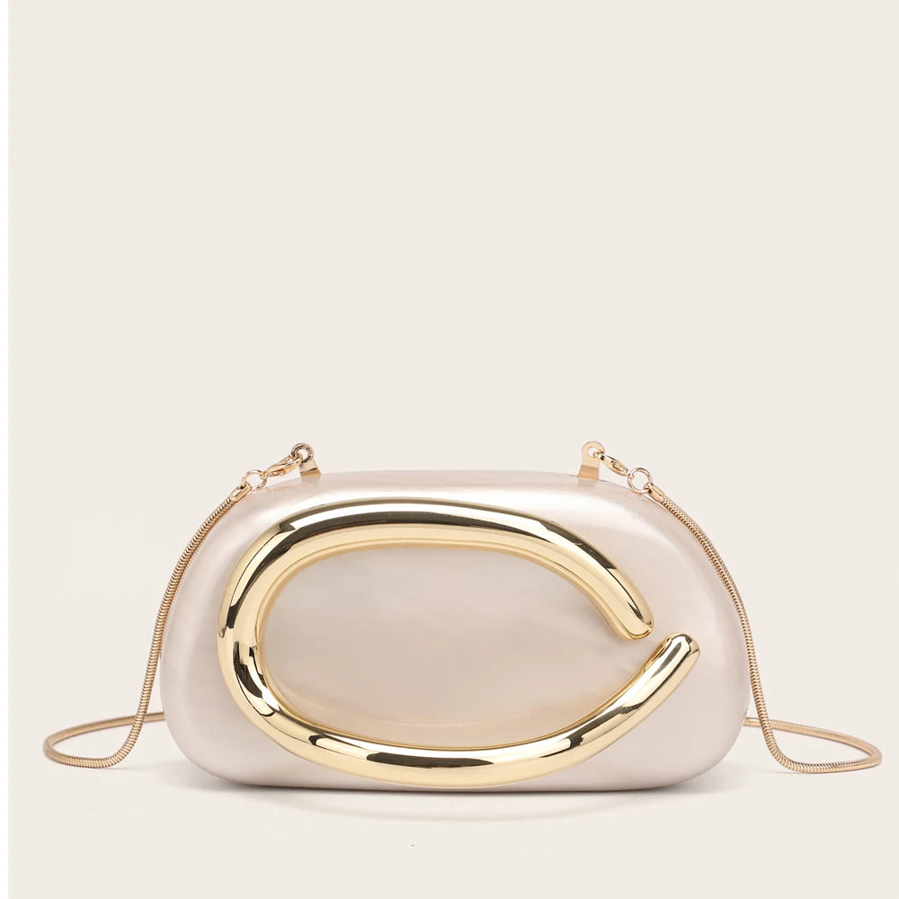 A light beige evening clutch bag with a gold-tone curved design and gold chain strap.